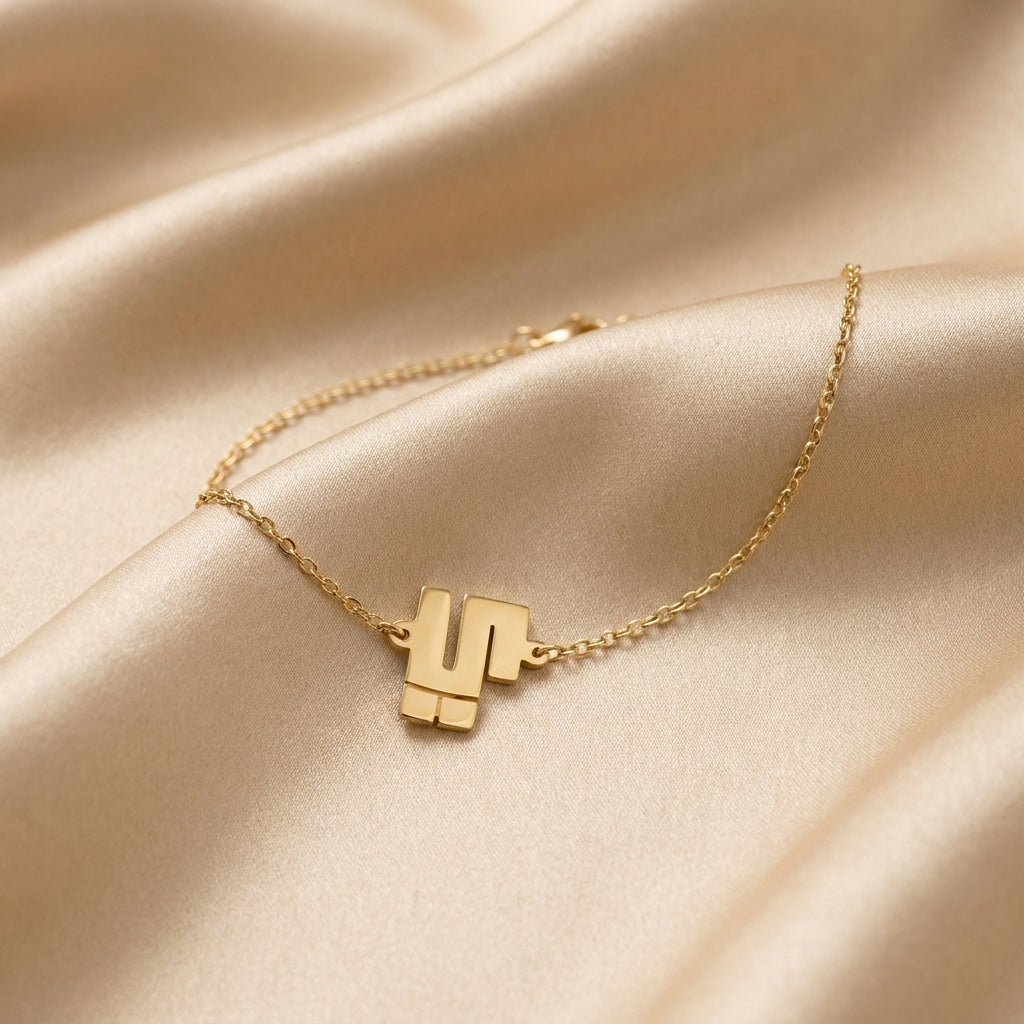 Mila – Bracelet chaîne fine symbole Or
