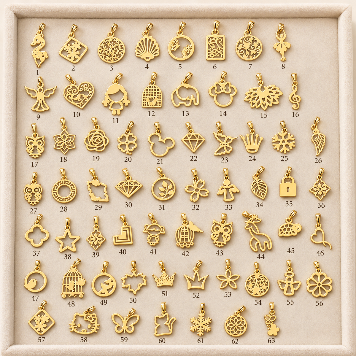 Assortiment de charms et pendentifs en Or à motifs variés