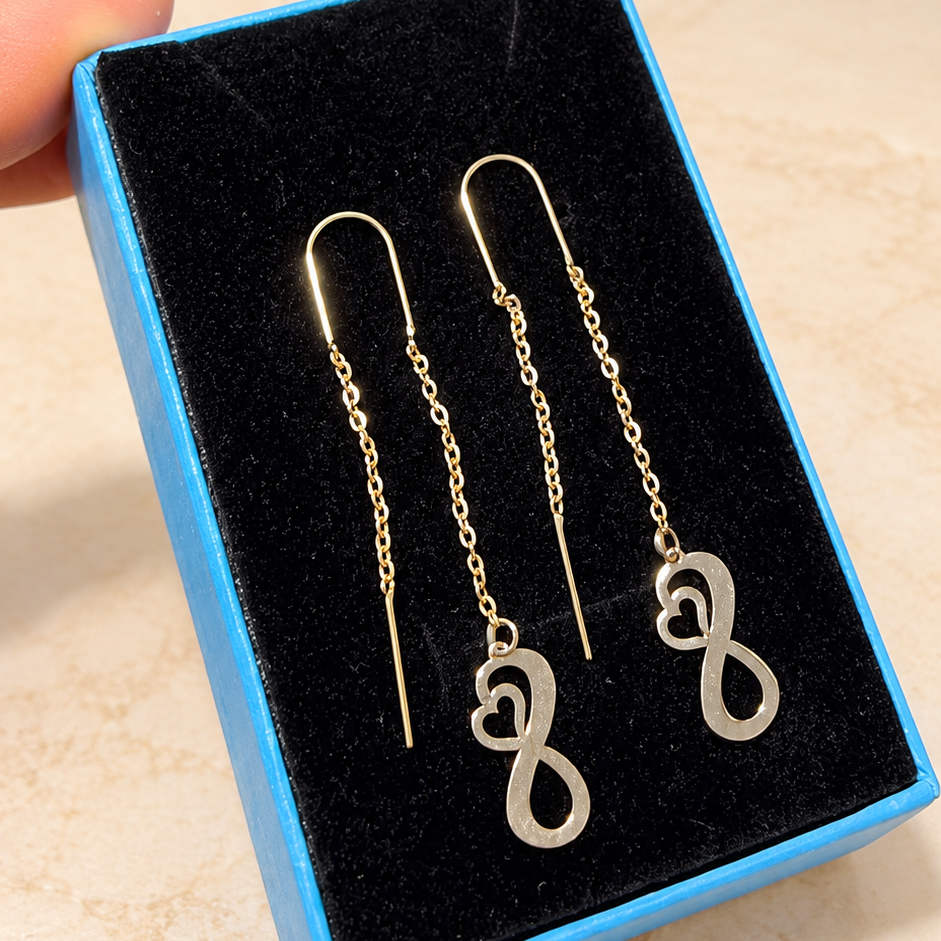 Boucles d’oreilles traversantes dorées à symboles infini