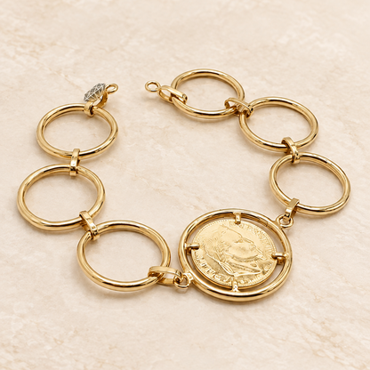 Bracelet doré à maillons anneaux et médaille façon pièce