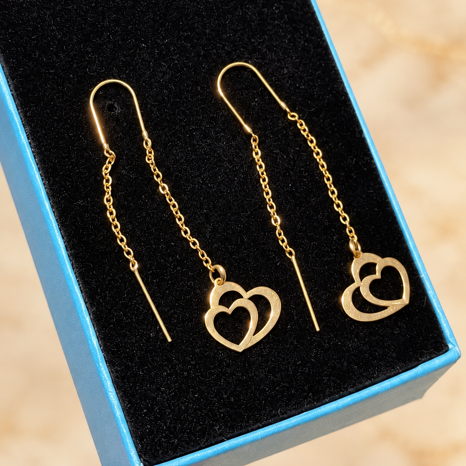 Boucles d’oreilles traversantes dorées à cœurs entrelacés