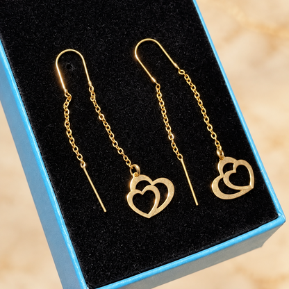 Boucles d’oreilles traversantes dorées à cœurs entrelacés