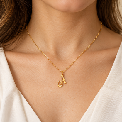 Pendentifs alphabet en écriture cursive — Série de lettres en Or  stylisées à suspendre.