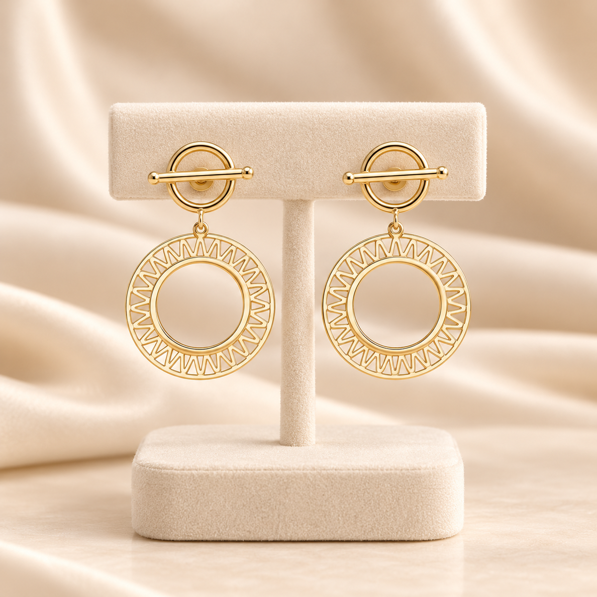 Boucles d’oreilles dorées à cercles ajourés rayonnants