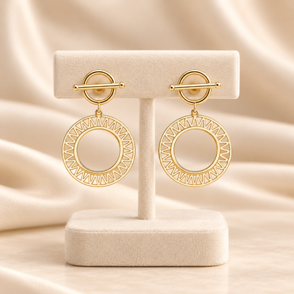 Boucles d’oreilles dorées à cercles ajourés rayonnants