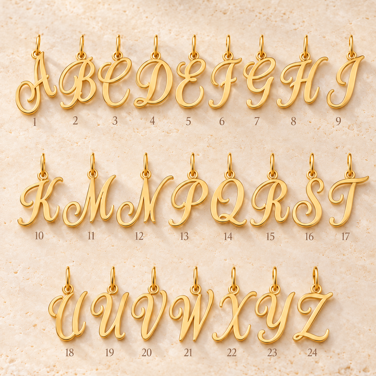 Pendentifs alphabet en écriture cursive — Série de lettres en Or  stylisées à suspendre.