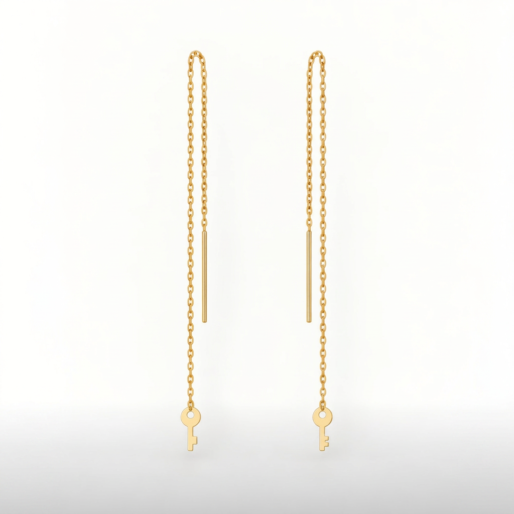 Boucles d’oreilles traversantes clé en or jaune 18K, packshot Charmays