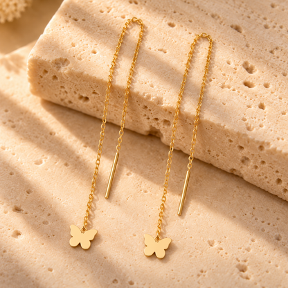 Boucles d’oreilles traversantes papillon en or jaune 18K sur travertin, Charmays